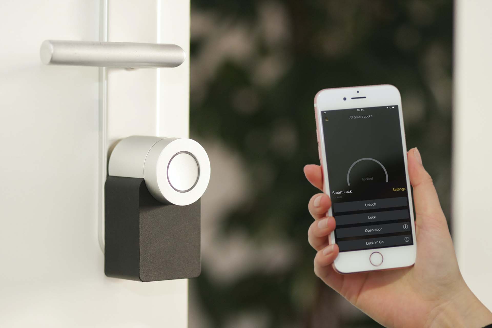 A person controlling a smart lock with a smartphone