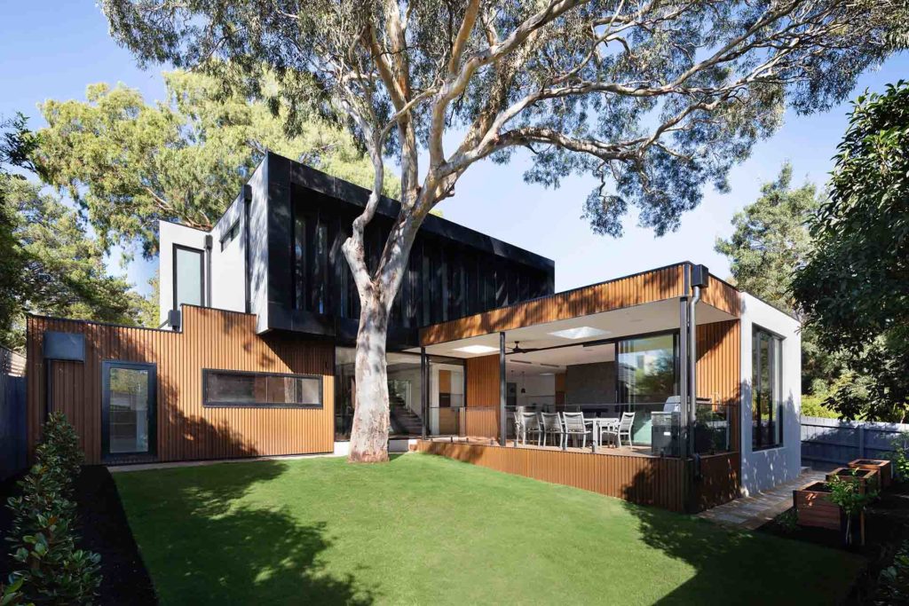 Modern house with a patio and a lawn 